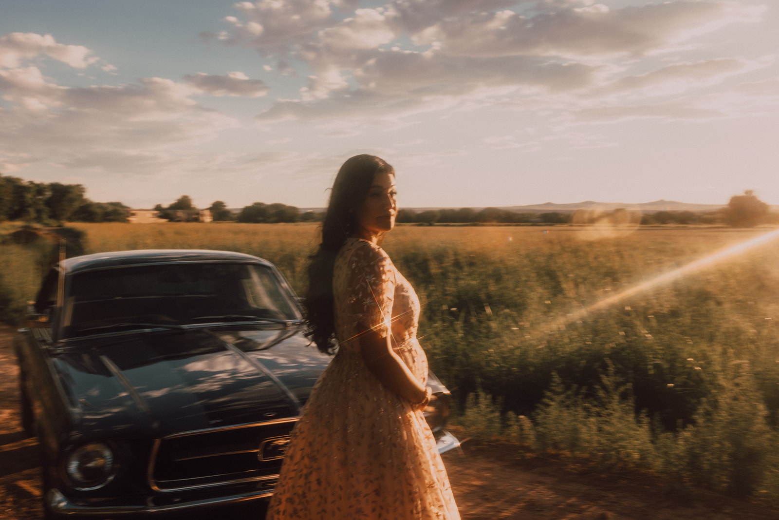 sunset maternity session with vintage car at golden hour