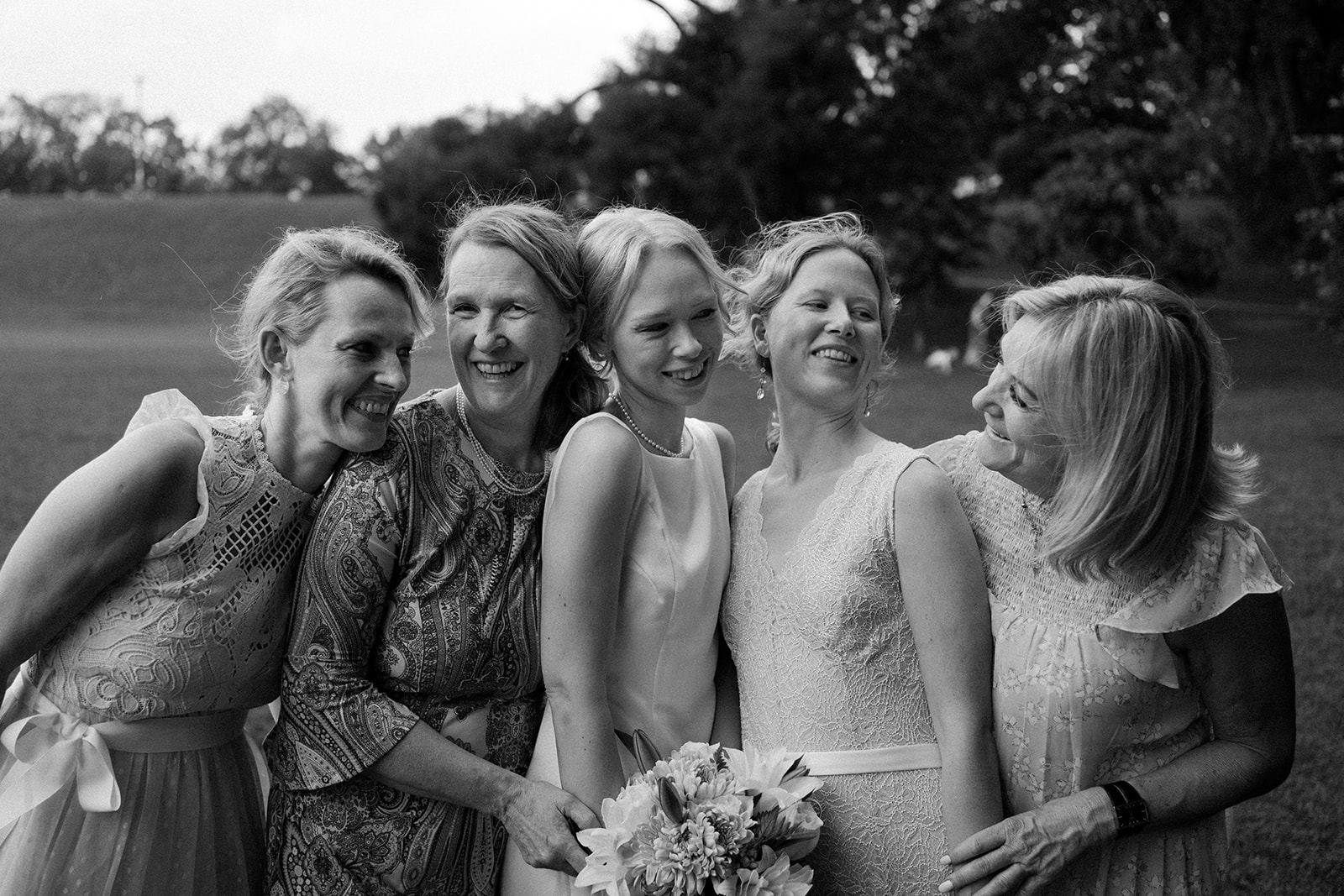 Bride smiling with women.