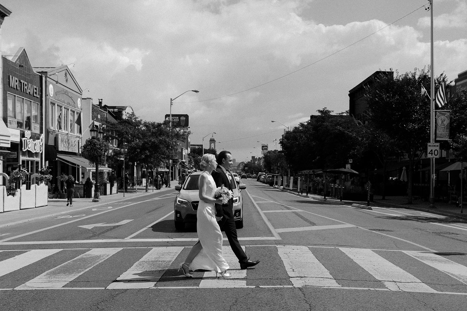 Man and woman walking across the road.