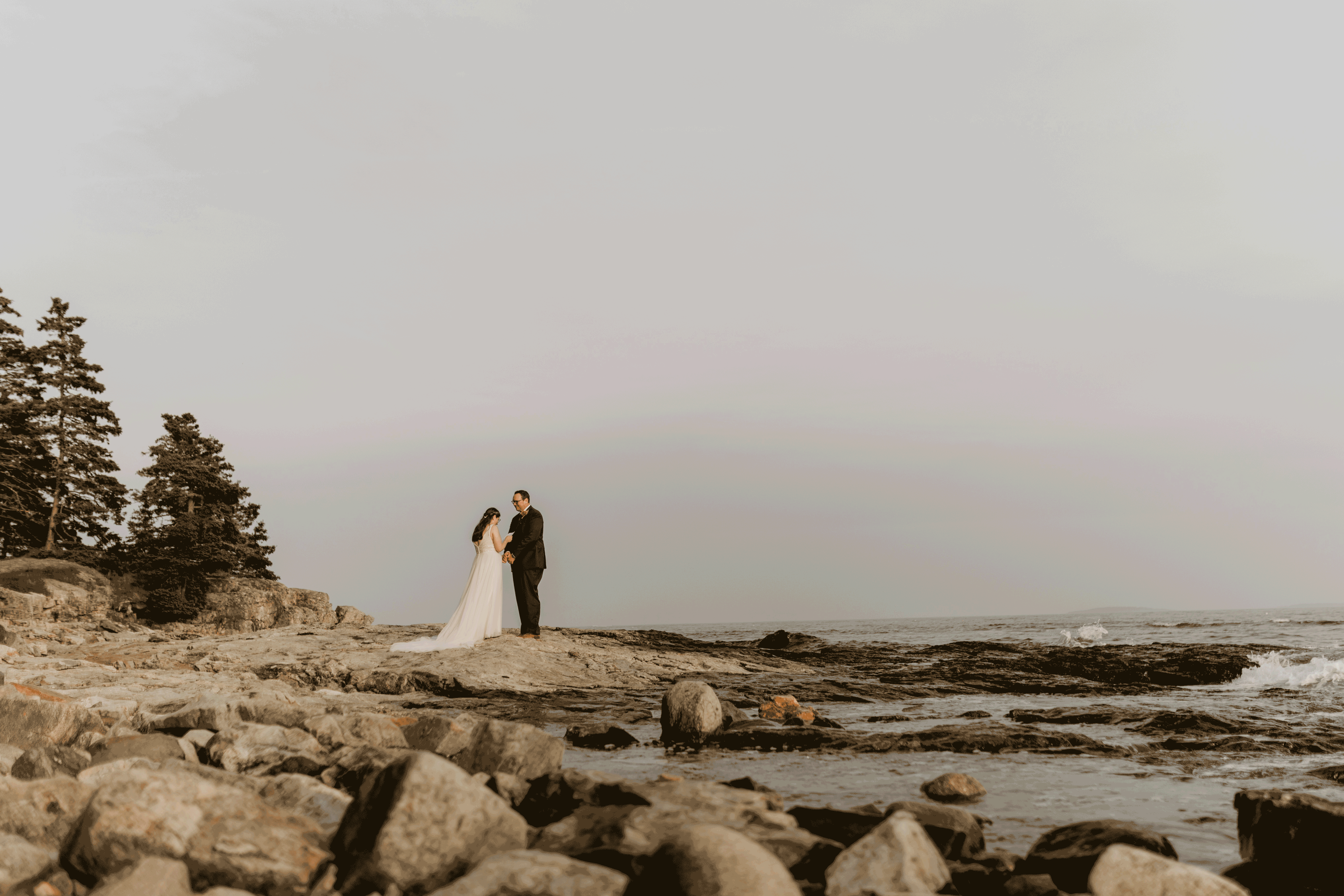 A bride and groom say their vows on their elopement day off the coast of Maine.