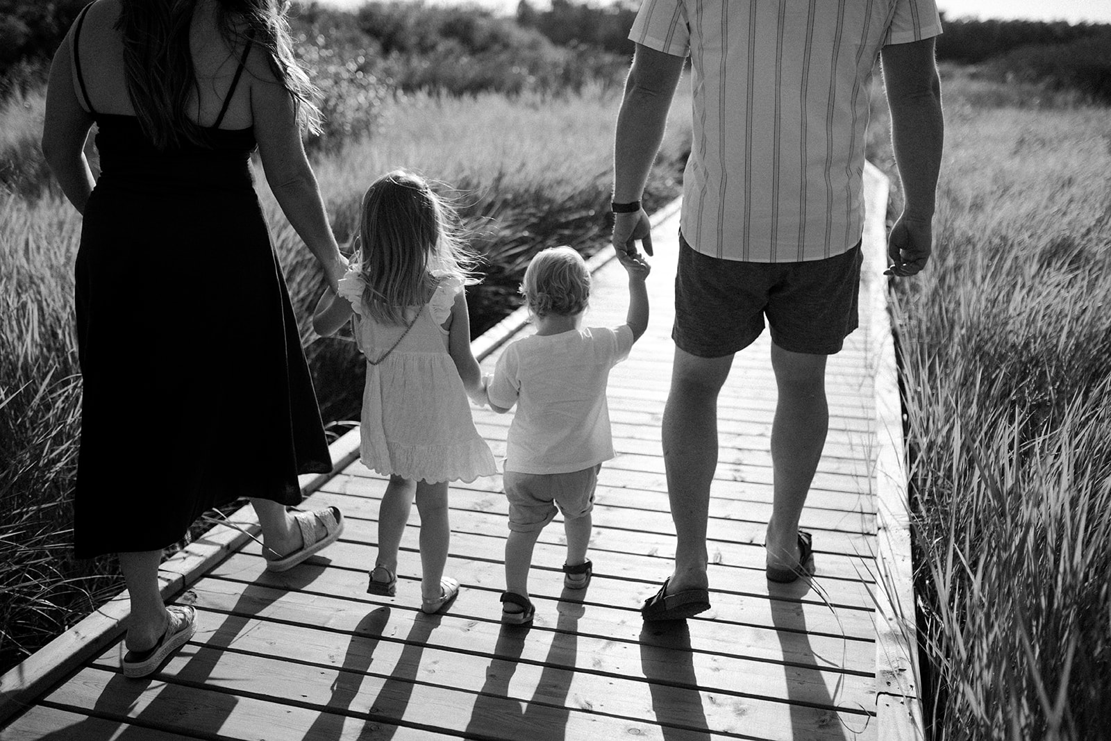 family walking holding hands