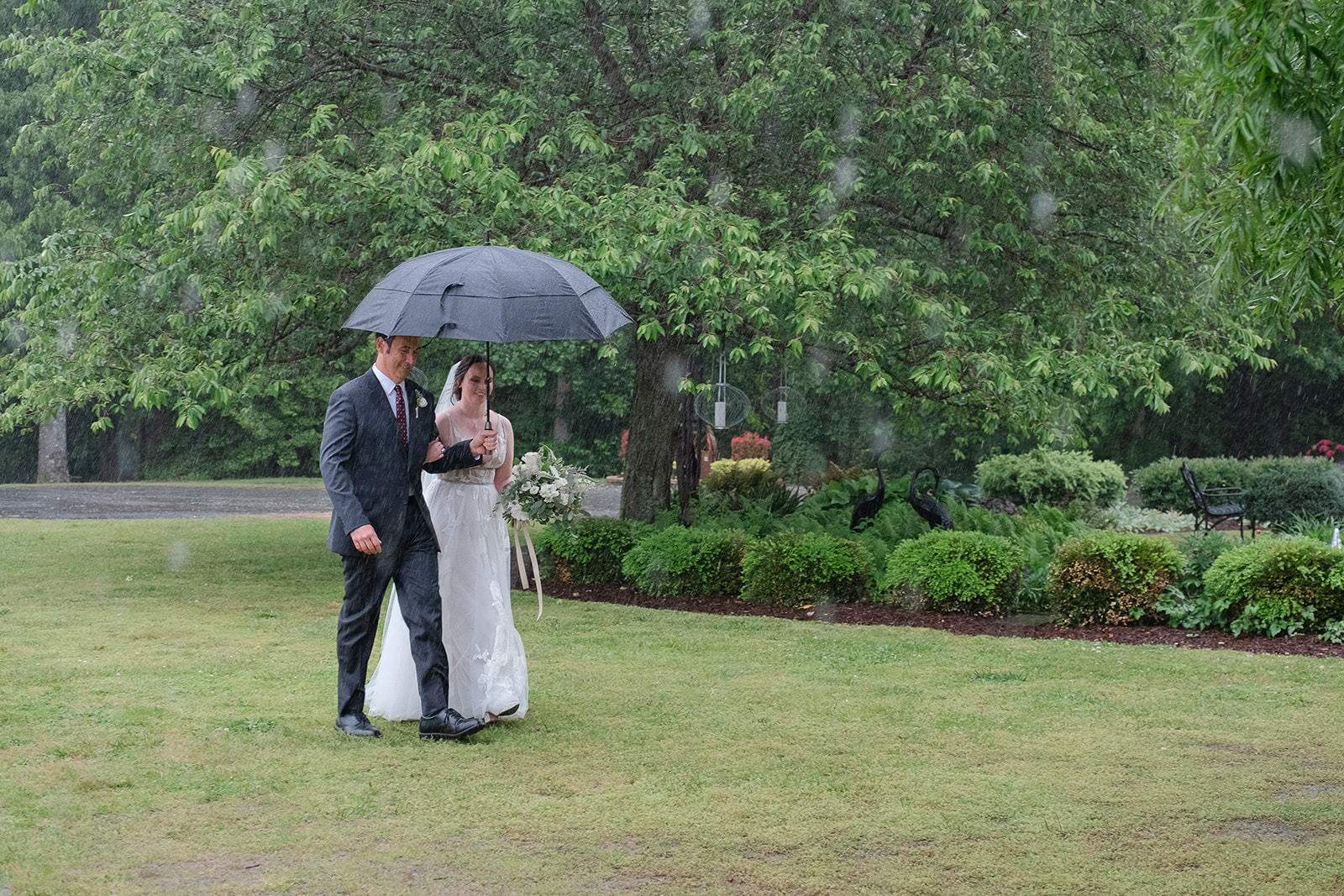 Oliver & Jess were married on a day that poured rain in Milton, DE.
