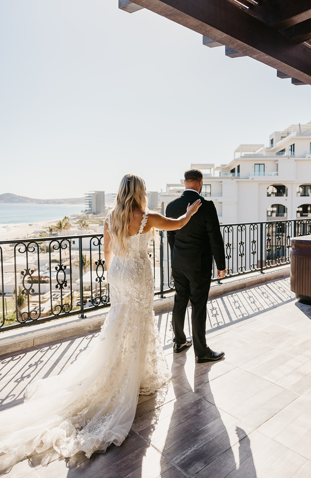 Bride does a first look with her brother at villa la valencia in cabo san lucas mexico 