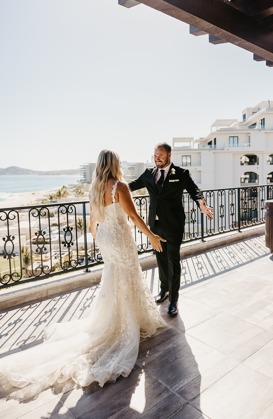 Bride does a first look with her brother at villa la valencia in cabo san lucas mexico 