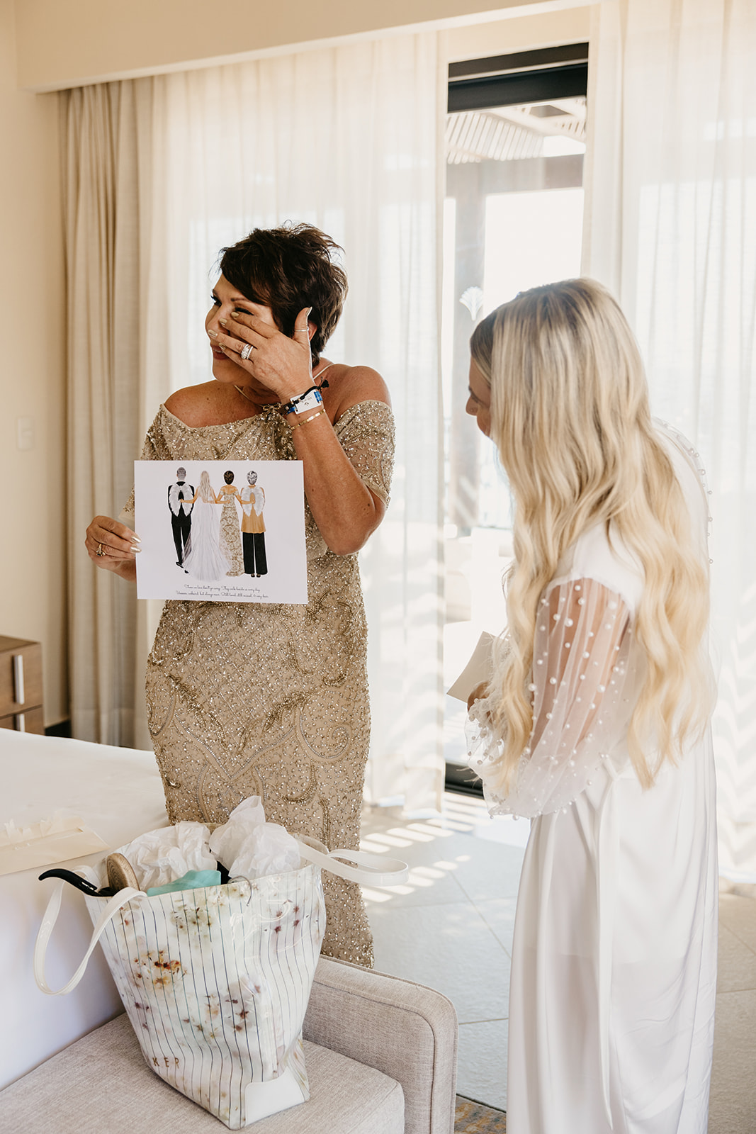 Bride gifts custom, sentimental watercolor painting to her mom on the bride's wedding day