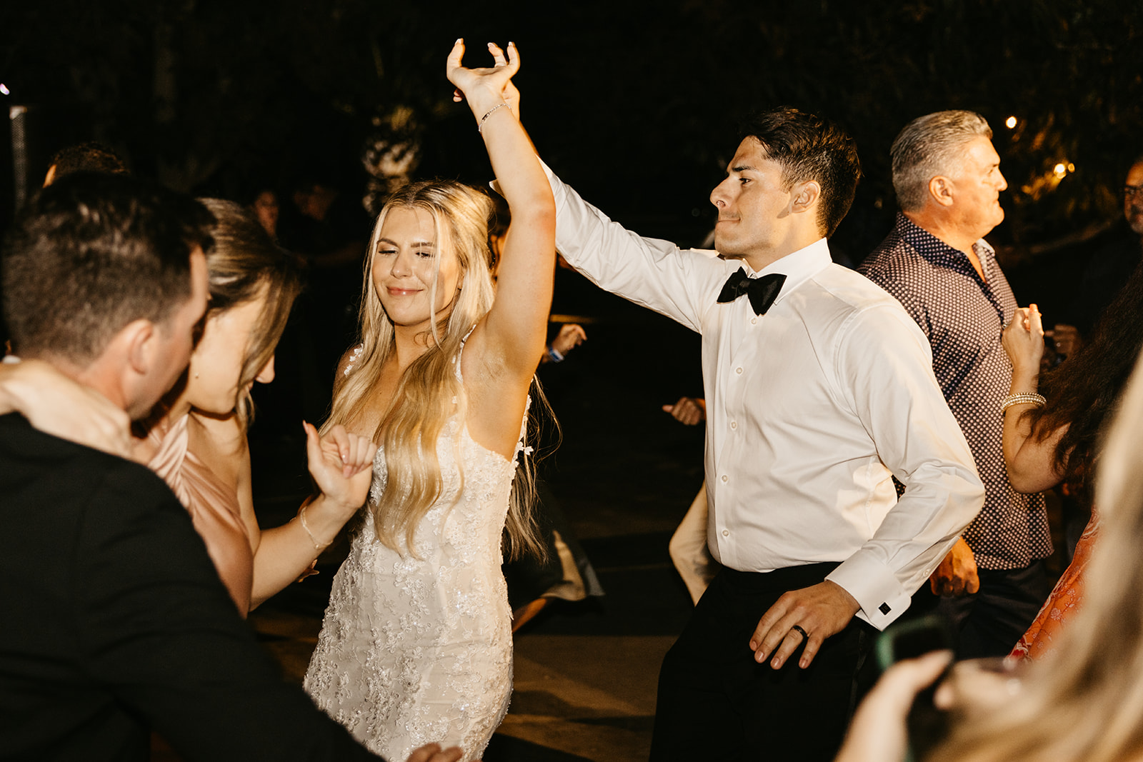 Bride and groom partying during their wedding reception at Acre Resort in Cabo San Lucas Mexico