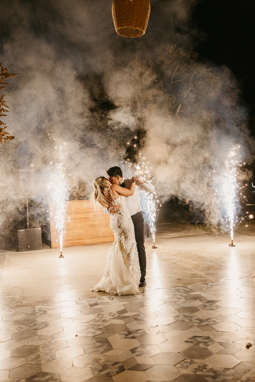 Bride and groom's sparkler first dance at their reception at Acre Resort Cabo 