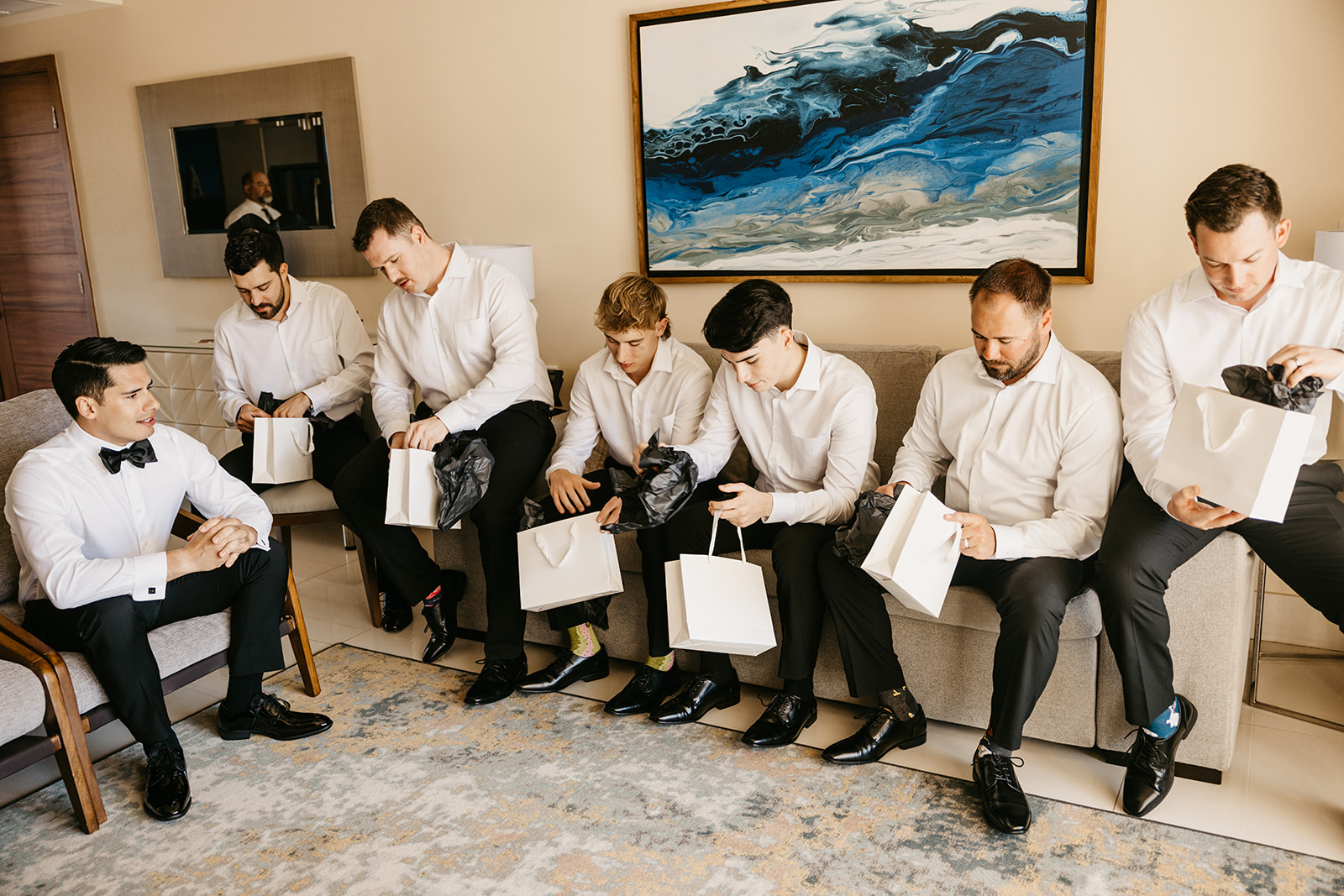 Groom gives gifts to his groomsmen at villa la valencia in cabo san lucas mexico