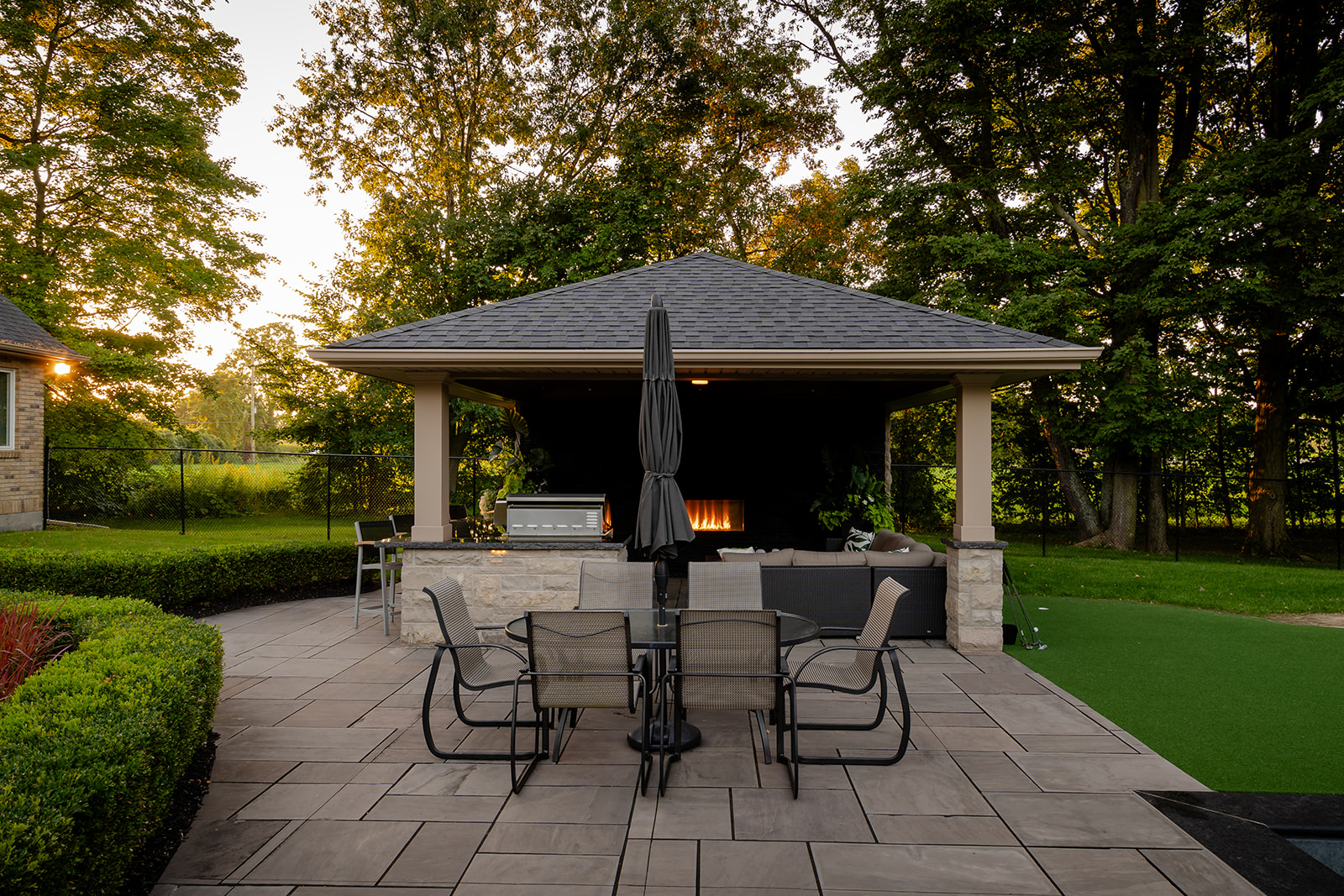 An outdoor patio set in front of the gazebo.