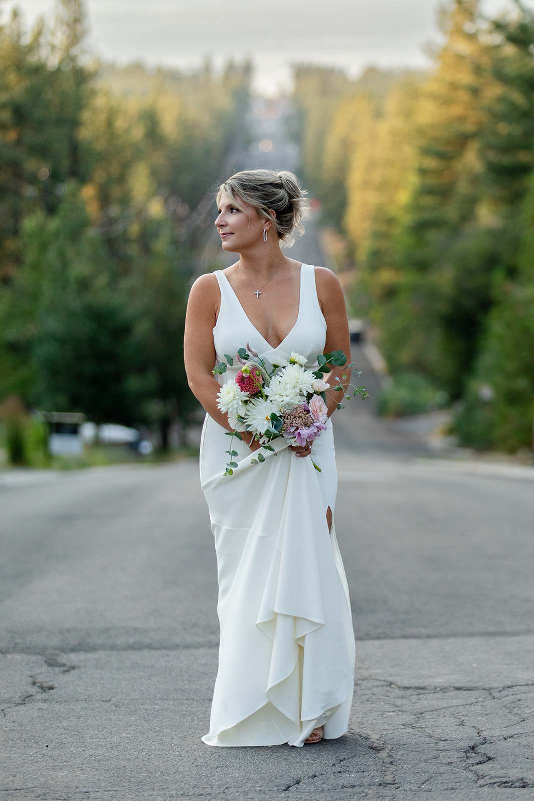 Bride standing in the middle of Ski Run Blvd on her way to elope in Lake Tahoe, CA
