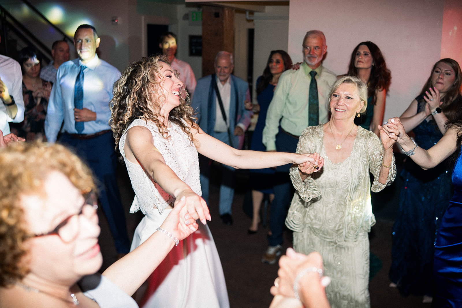 bride and groom dance with their guests