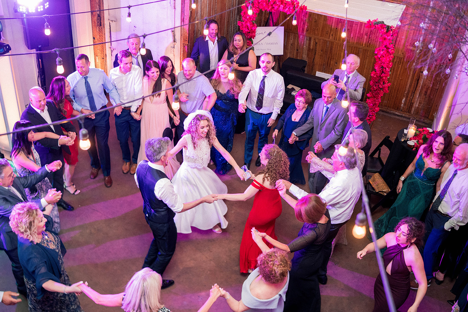 bride and groom dance with their guests