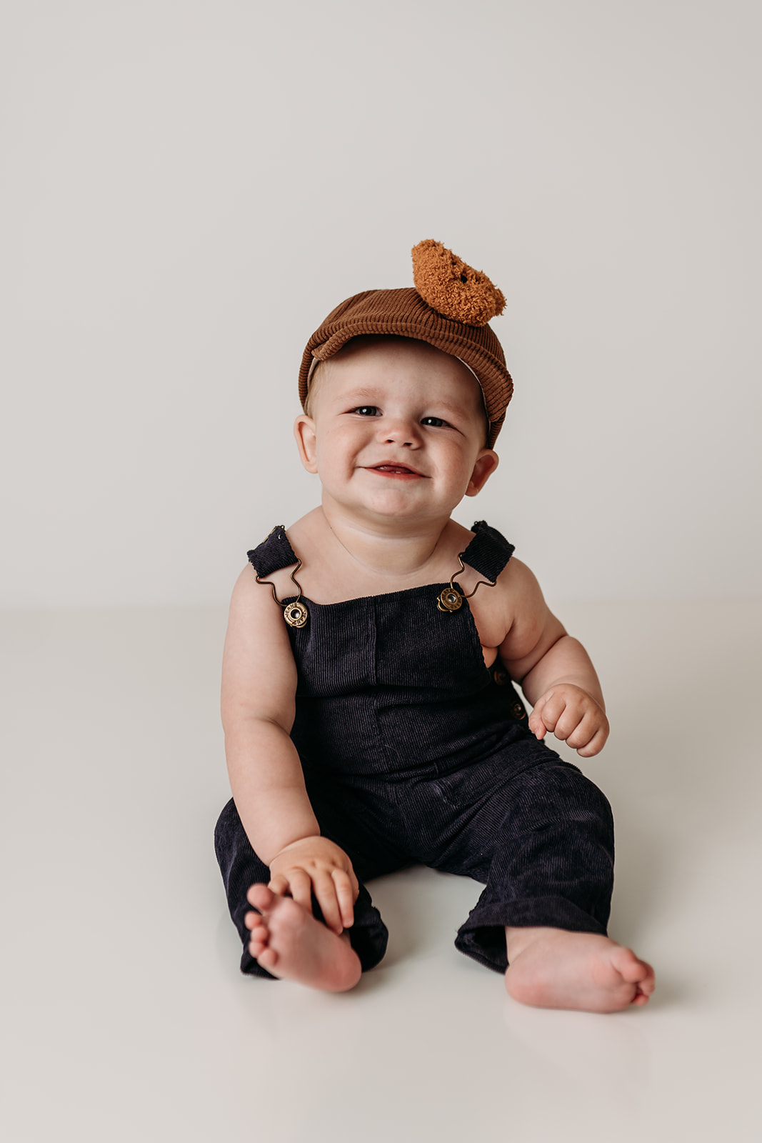 9month old smiles for photo with Heather Ann Photography