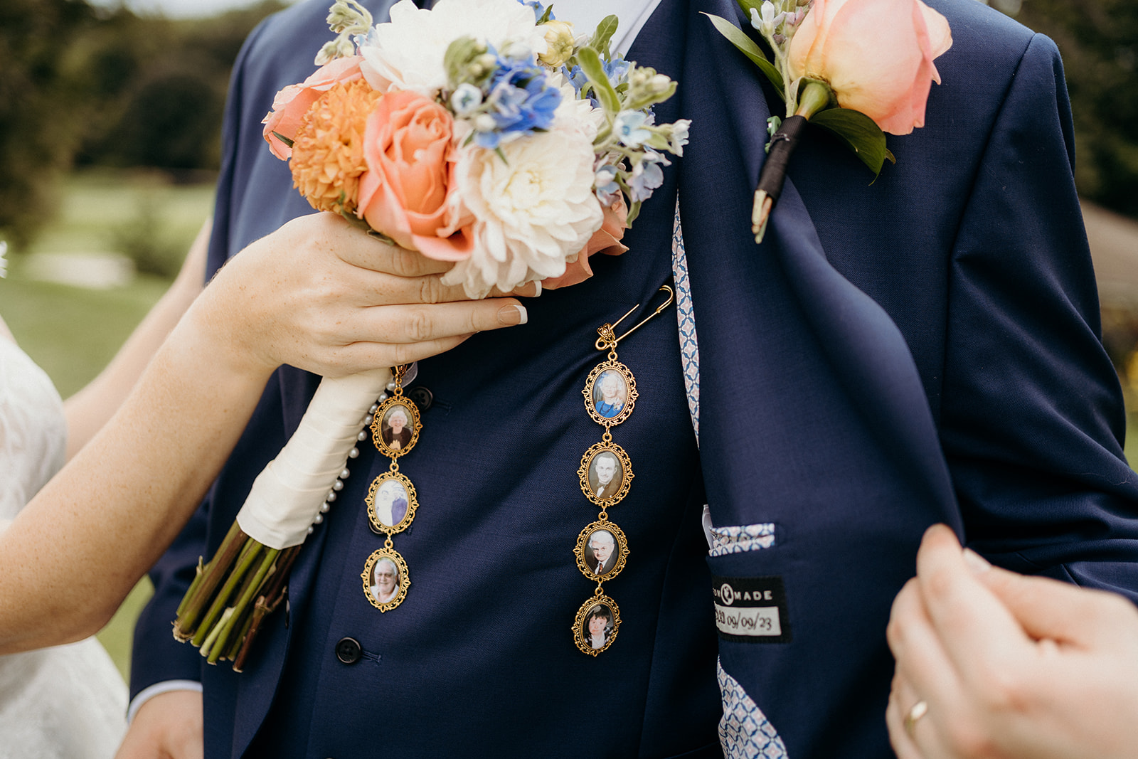 Portraits pinned to a jacket with a bouquet of flowers.