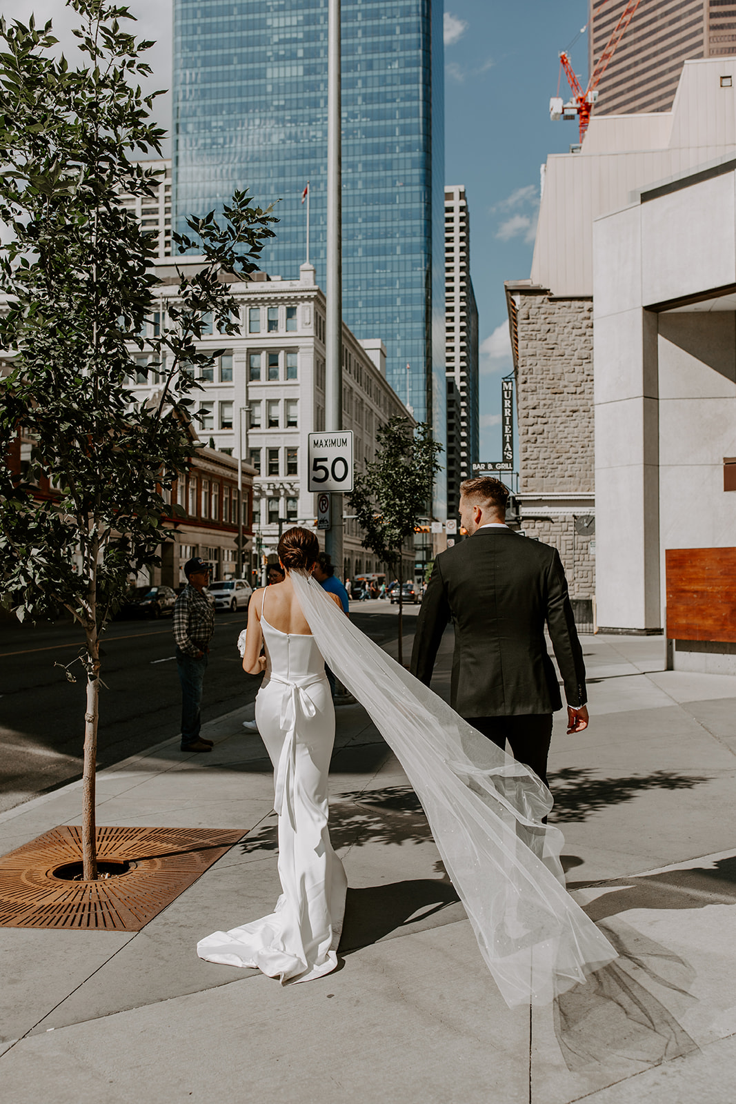 Bride and Groom Walking downtown Calgary 