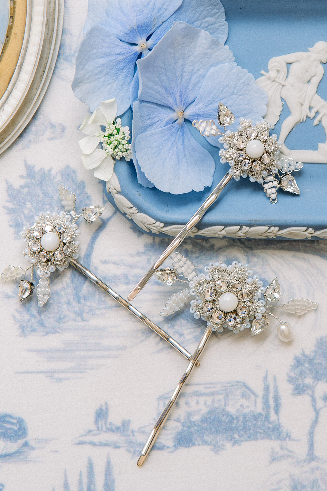 Elegant flat lay of wedding accessories with a destination wedding theme, featuring elements from Ireland's local artisa