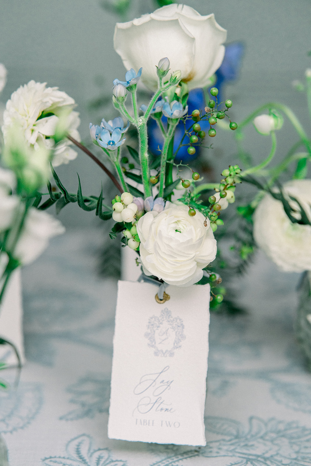 Floral arrangement in blue and ivory hues by Frog Prince Weddings, adorning a destination wedding aisle in Ireland's Cas