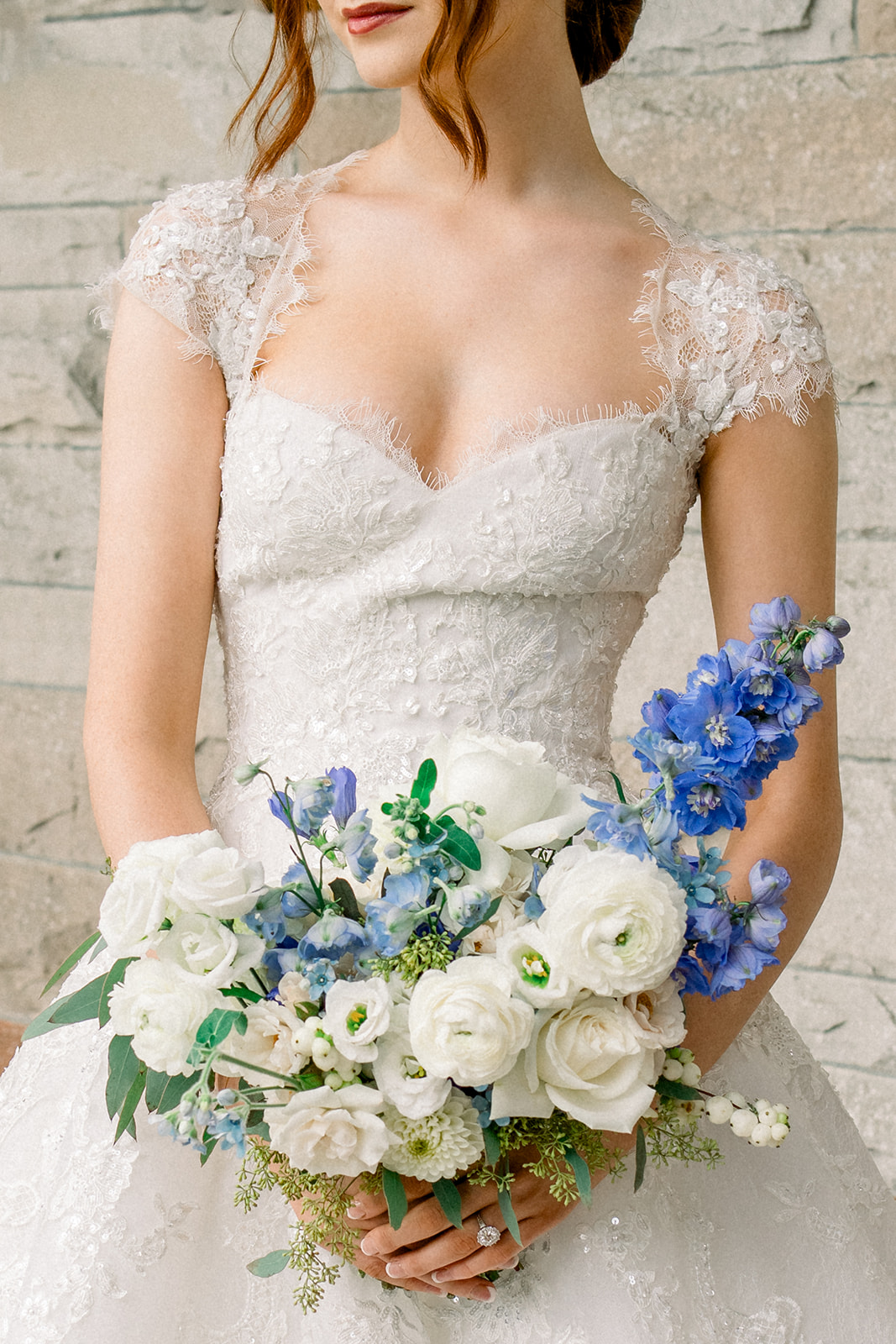 Floral arrangement in blue and ivory hues by Frog Prince Weddings, adorning a destination wedding aisle in Ireland's Cas