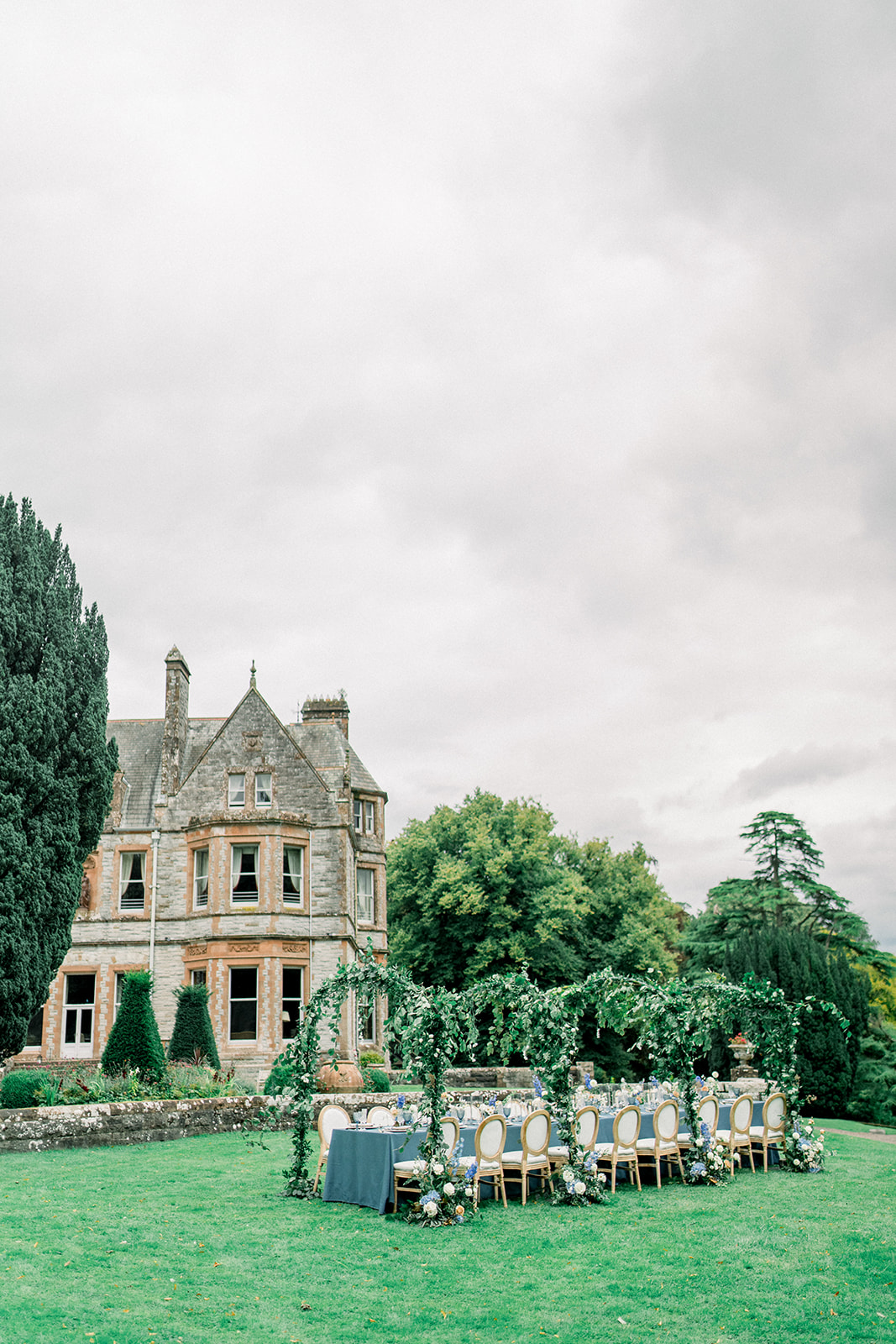 Outdoor reception by the lake at Castle Leslie, set for a magical destination wedding in the heart of Ireland.