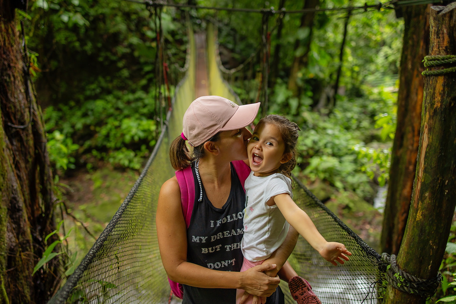 mother and daughter on suspension bridge