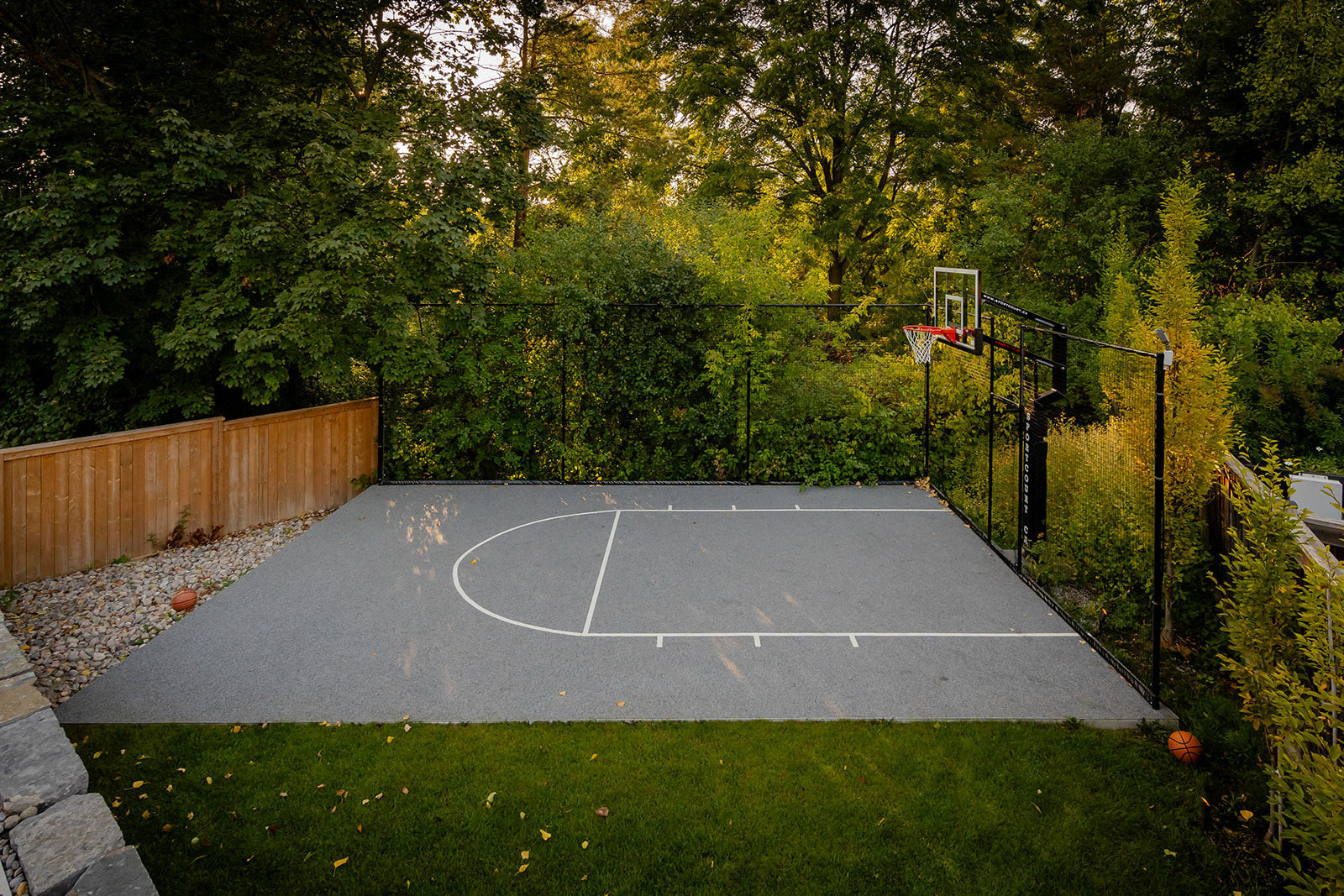 A practice basketball court with one net.