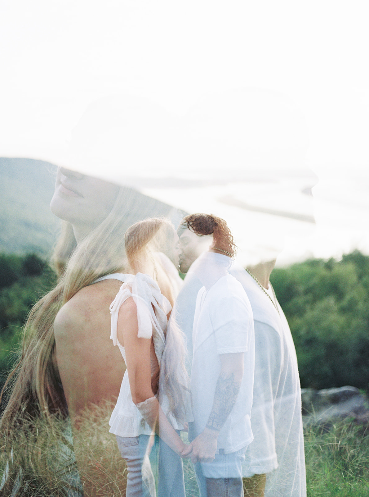 A double exposure kiss of an engaged couple in Section, Alabama by Kelsey Dawn Photography