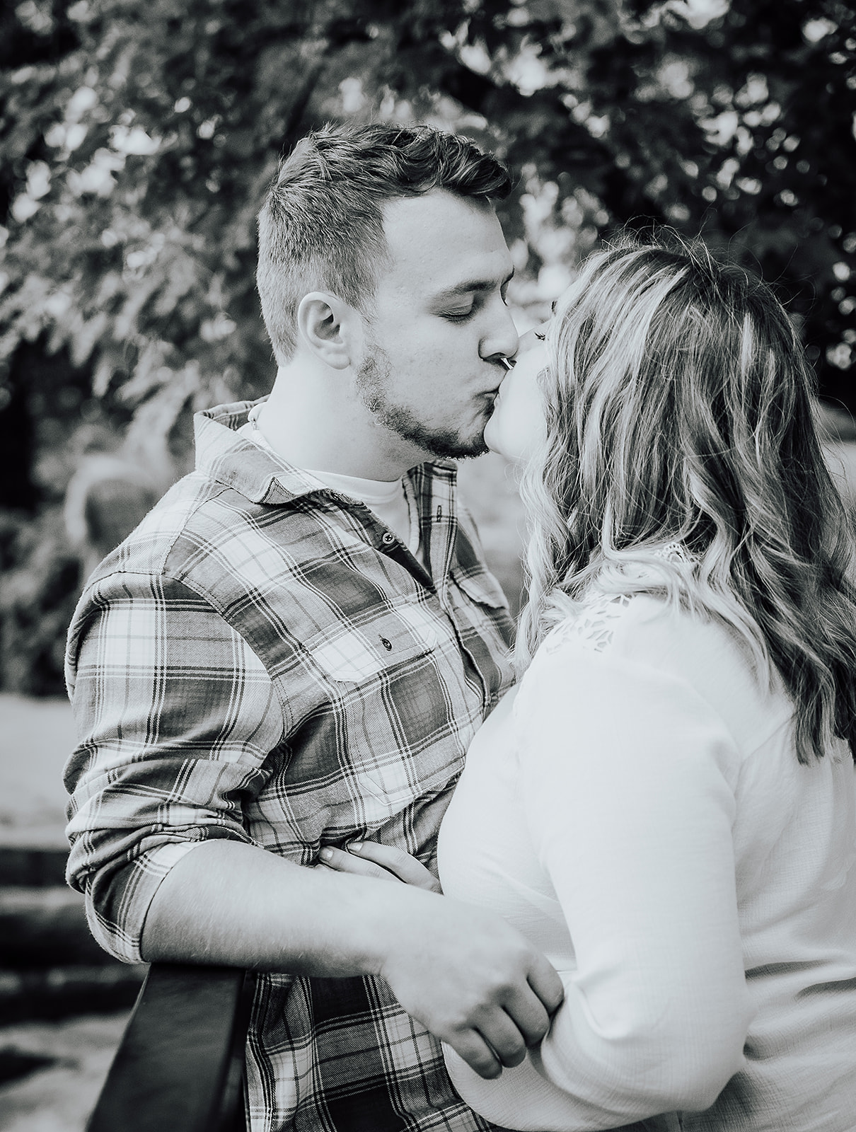 Black and white image of couple kissing Cox Arboretum Dayton Ohio