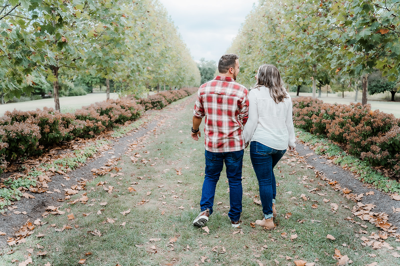 Couple walking away from camera Cox Arboretum Dayton Ohio