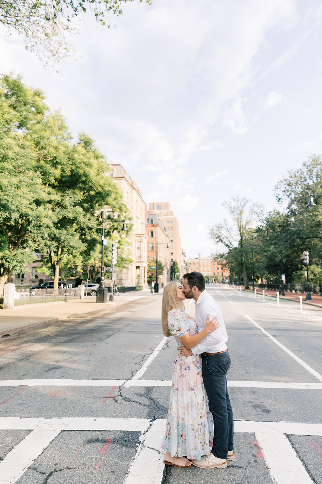 couple crossing the crosswalk in boston for engagement photos