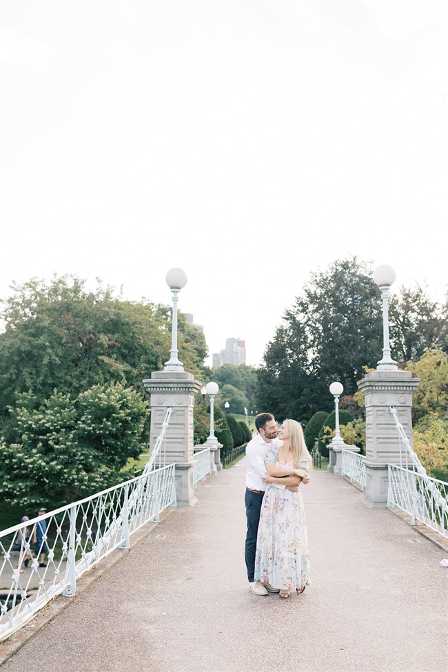 couple on the bridge in boston public garden