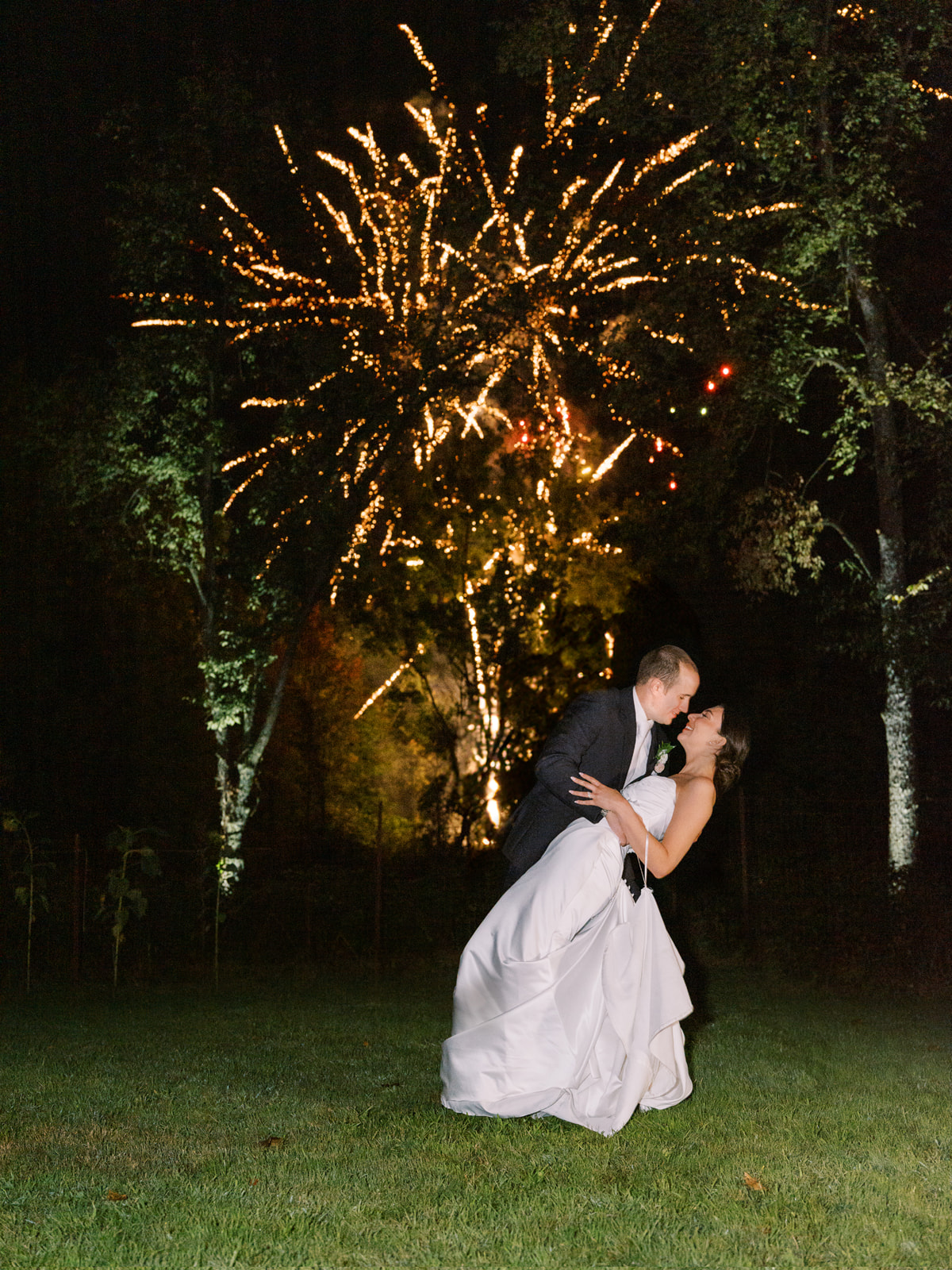 couple watching fireworks at their cleveland backyard wedding