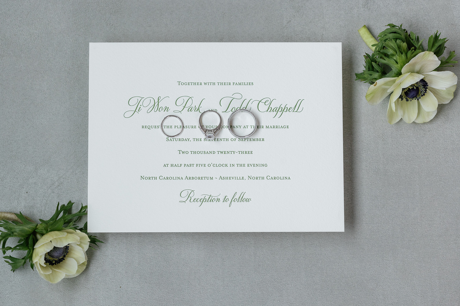 elegant letter pressed wedding invitation with green ink 