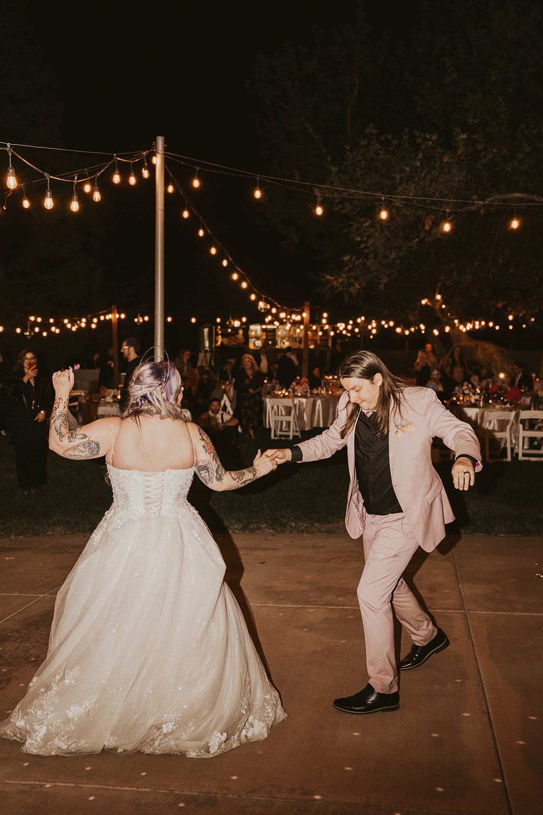 Bride and groom dance under disco ball during wedding reception in Livermore, California wine country