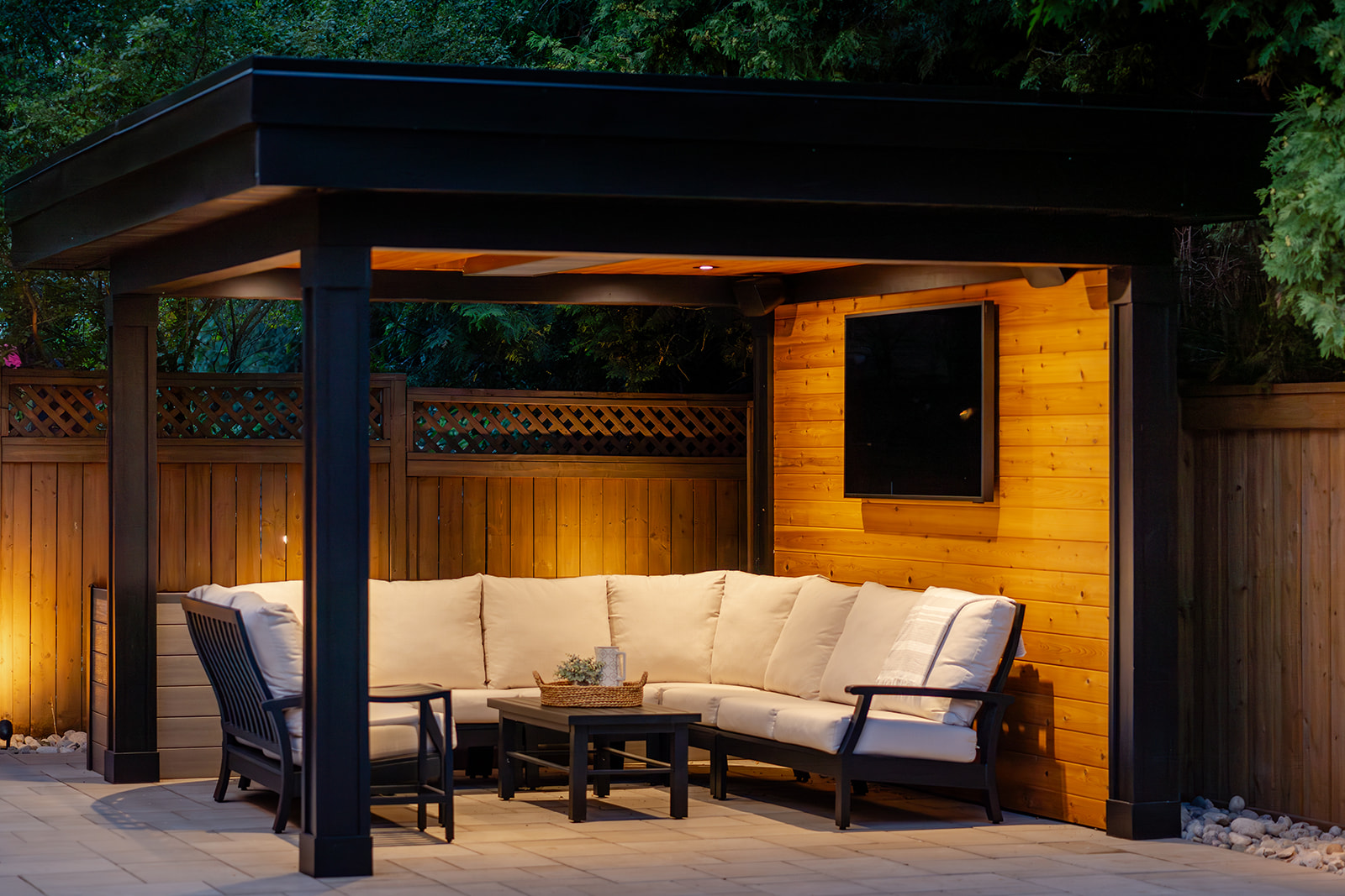 An outdoor seating area underneath a gazebo.