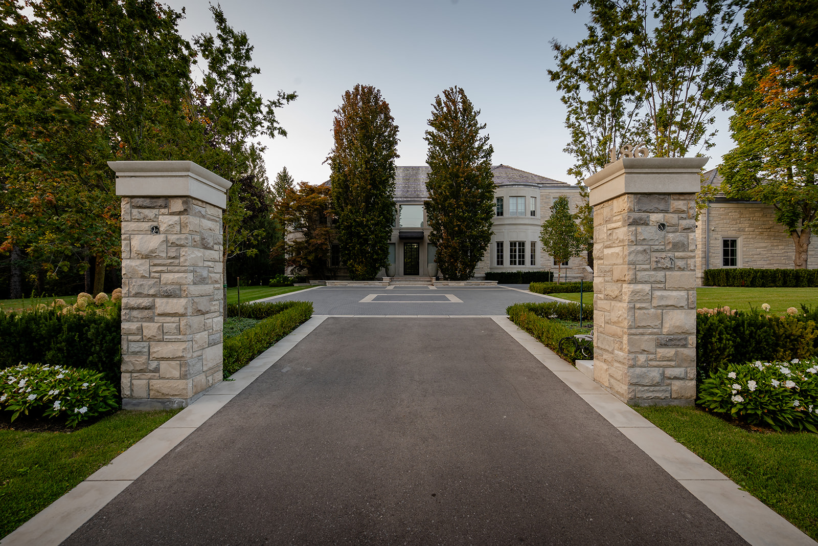 A large driveway leading to the house.