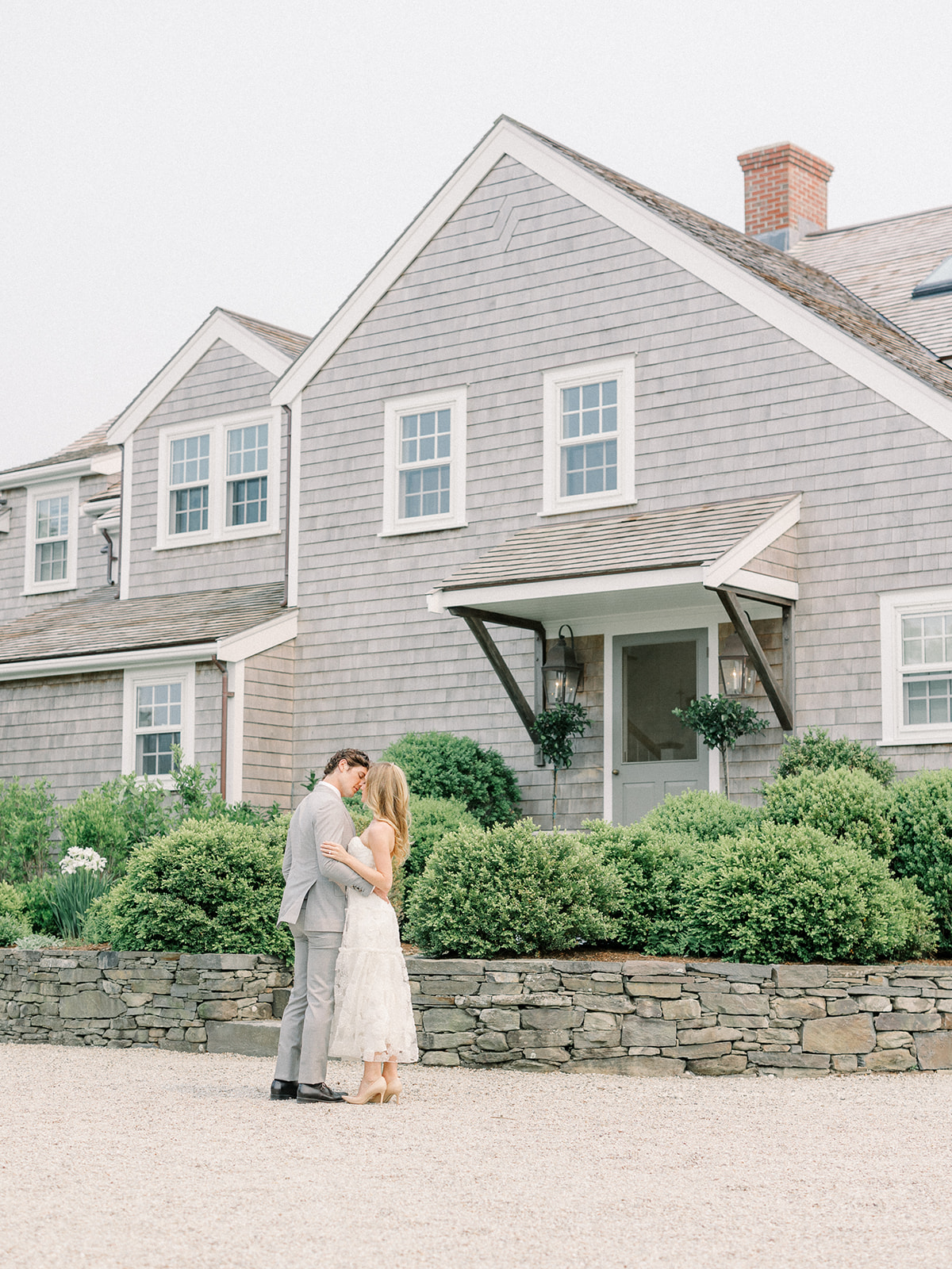 Bride and groom share a kiss at their summer wedding in Nantucket Massachusetts.