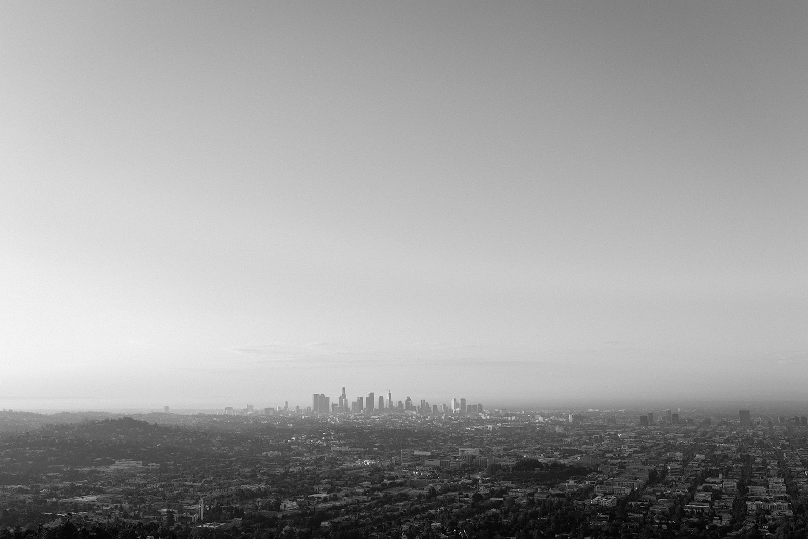 the stunning views sunrise engagement session with engagement couple at los angeles' griffith observatory