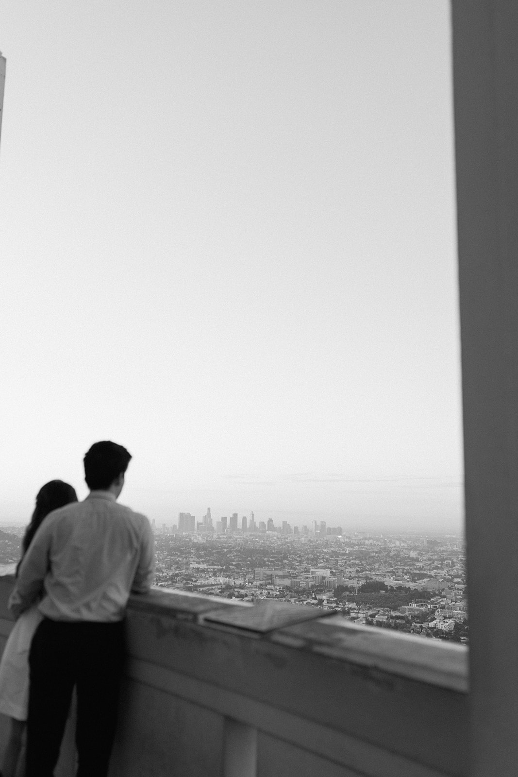 the views during sunrise engagement session with engagement couple at los angeles' griffith observatory