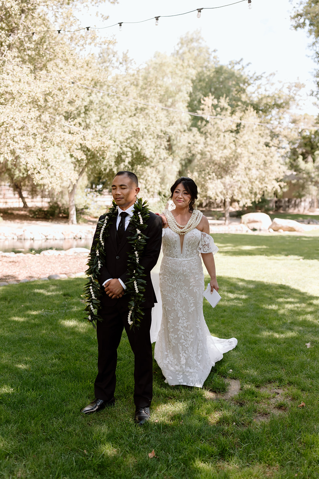 first look candid image of wedding couple on wedding day at galway downs temecula california