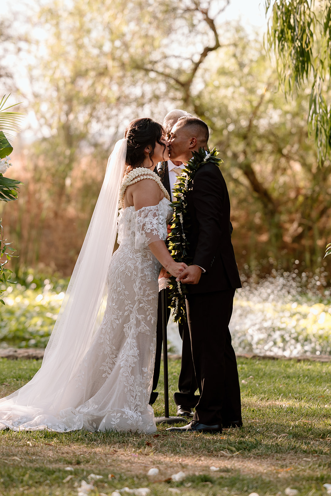 candid first kiss image of wedding couple on wedding day at galway downs temecula california