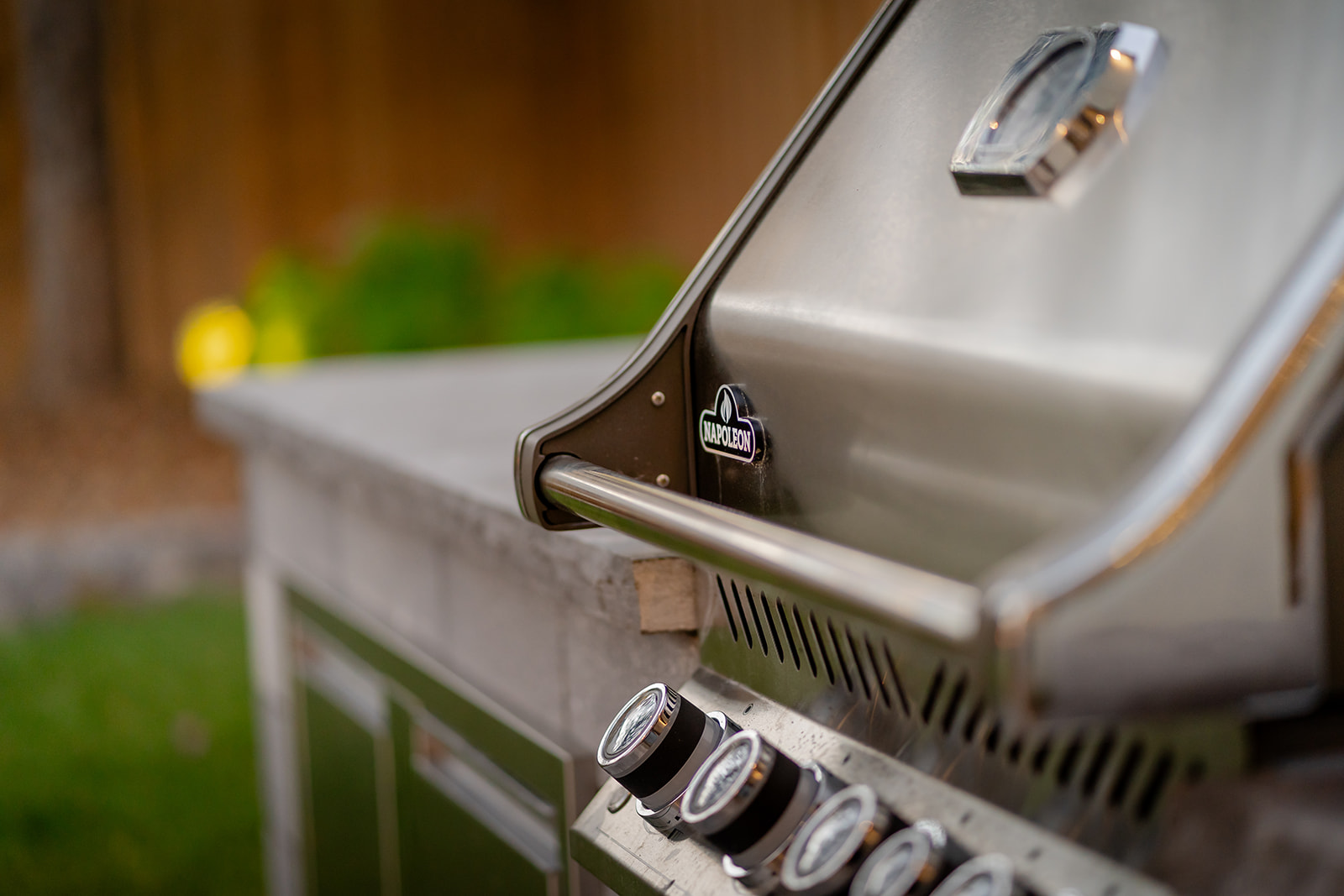 A silver barbeque outside.