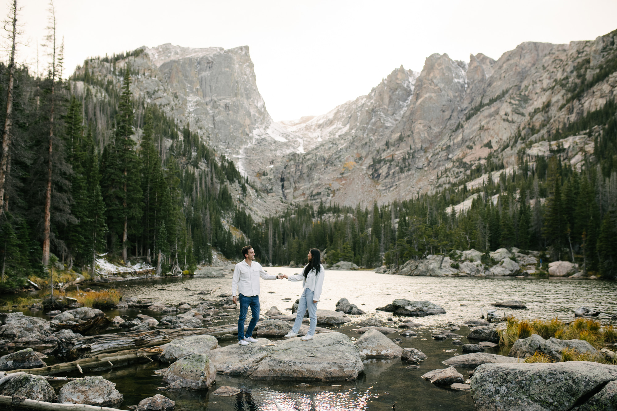 A documentary-style and candid engagement session at Dream Lake in Rocky Mountain National Park.
