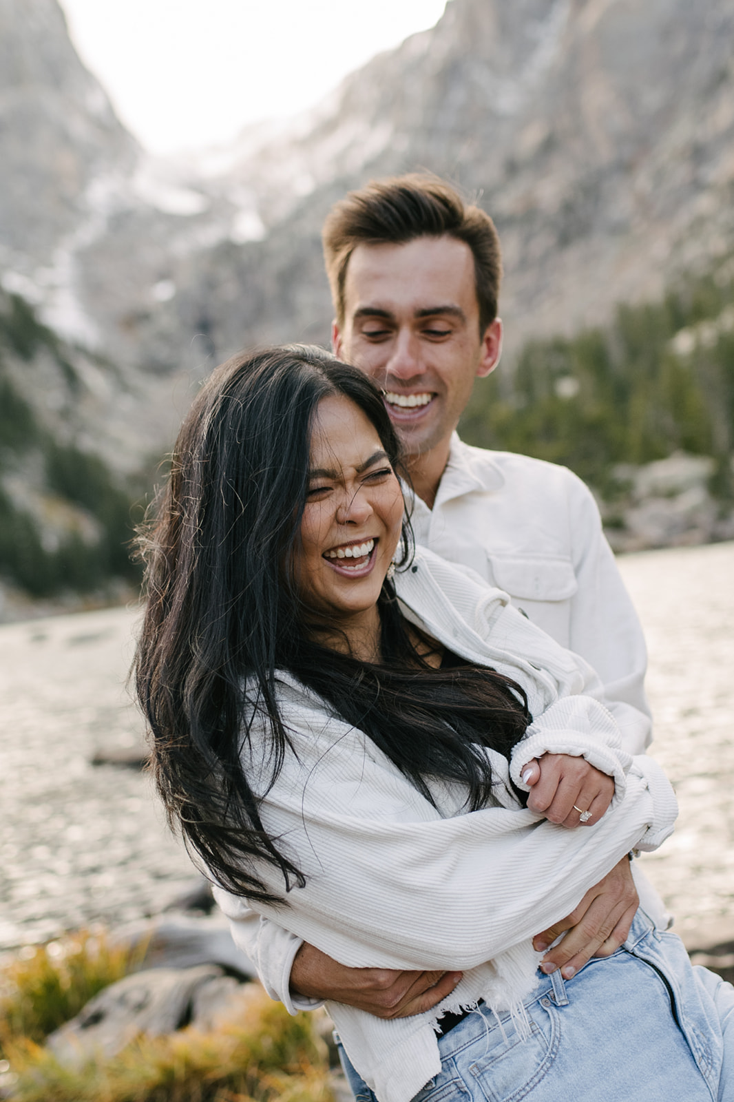 A documentary-style and candid engagement session at Dream Lake in Rocky Mountain National Park.