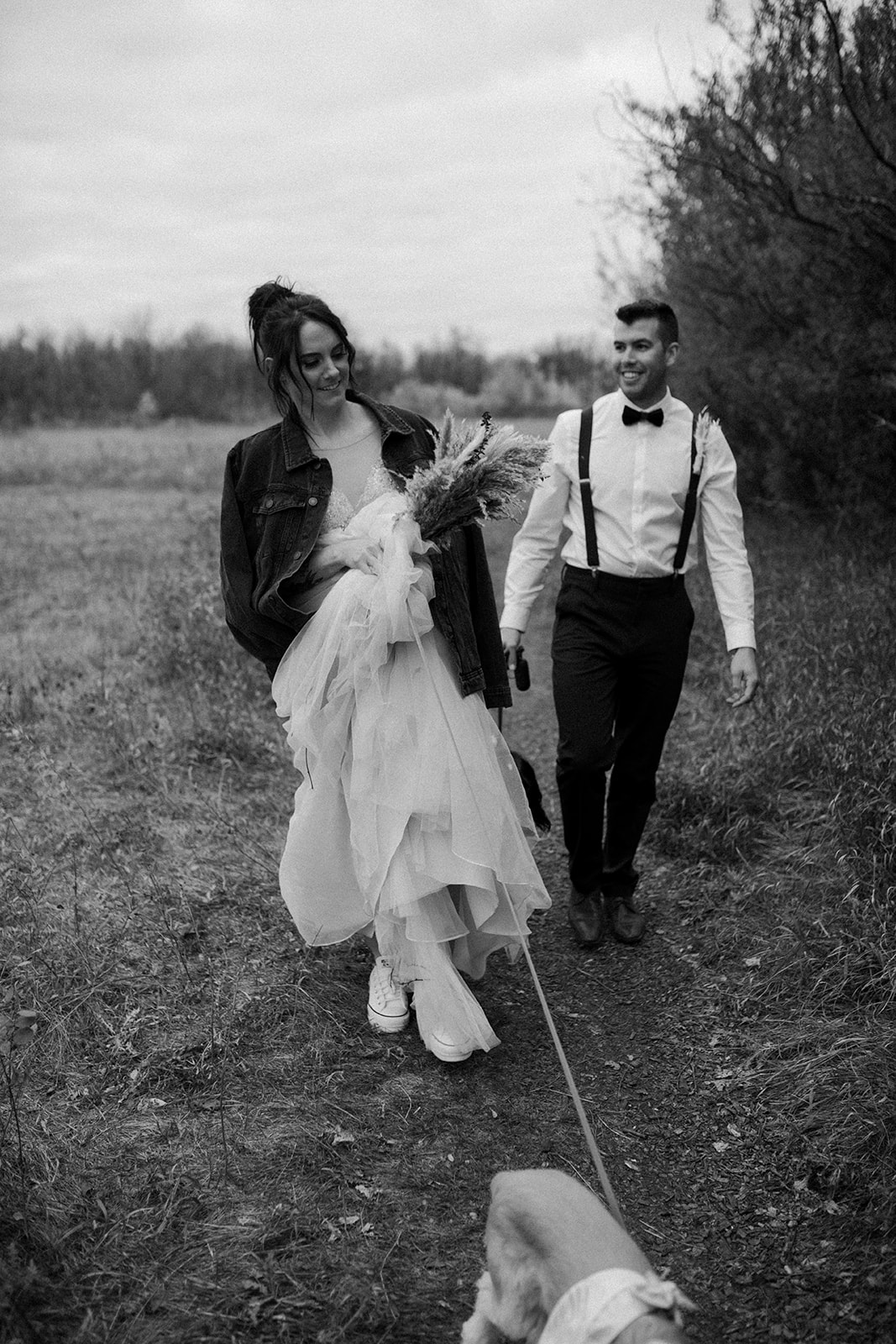 bride and groom and their dogs in living prairie museum in winnipeg