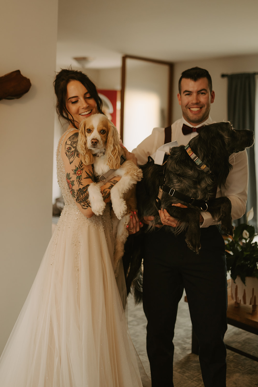 bride and groom with their dogs in winnipeg