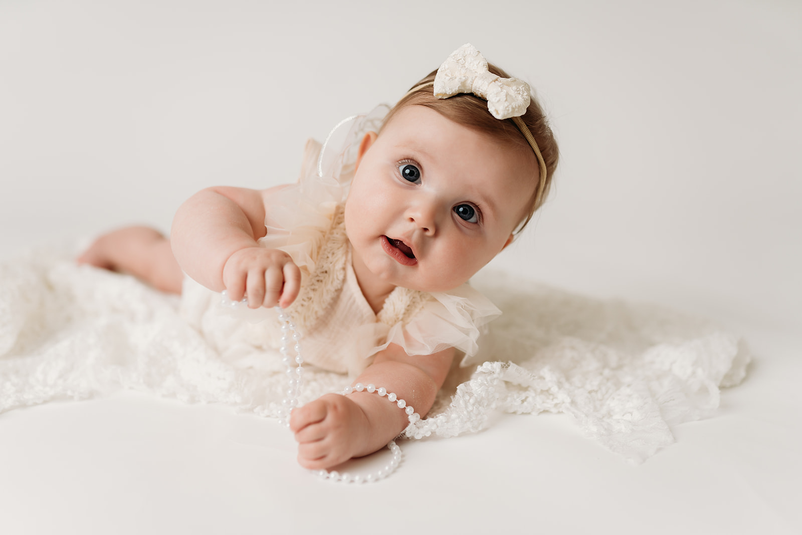 Adorable 6 month milestone session at a Colorado Springs studio with Heather Ann Photography