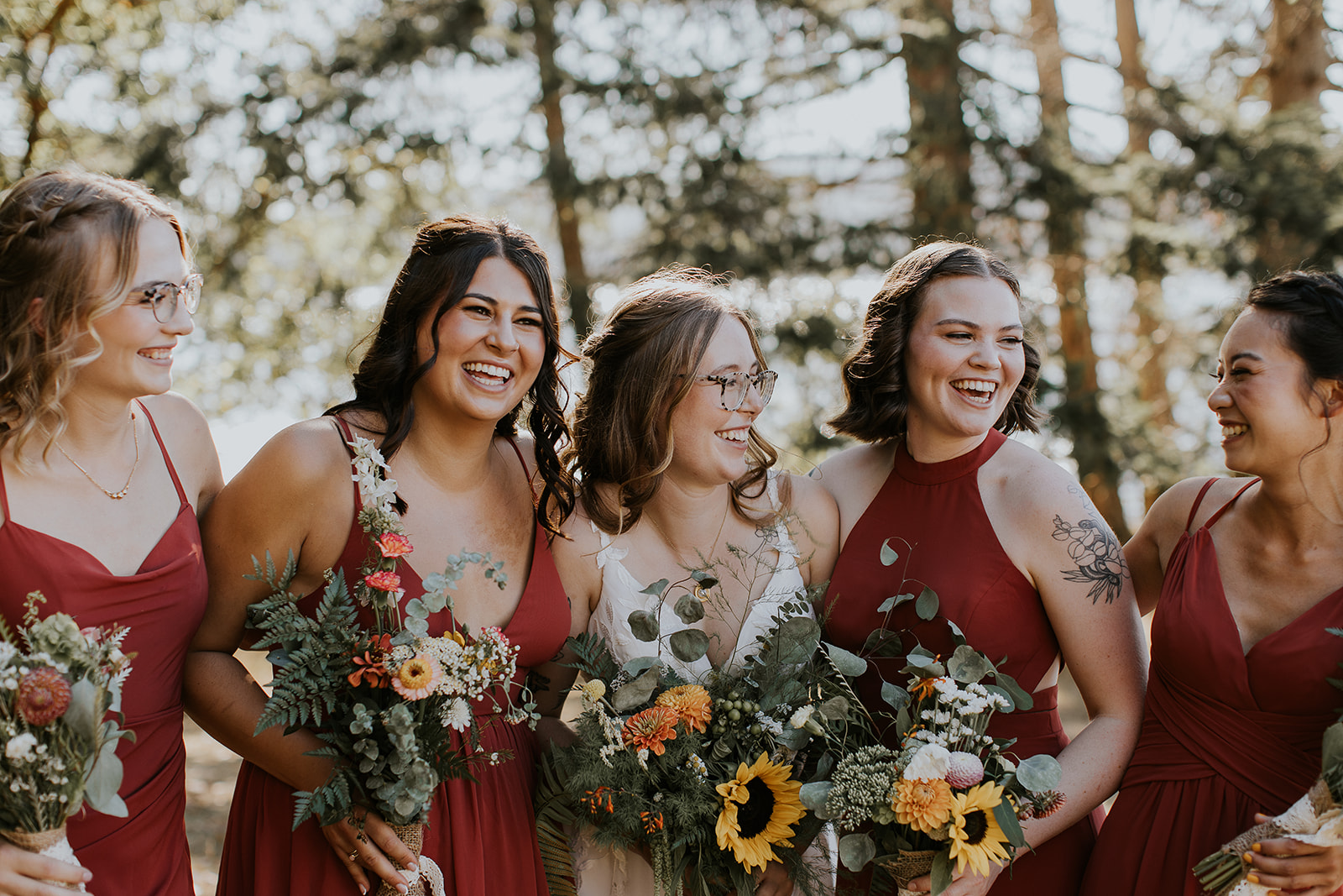 bride smiling at her bridesmaids 