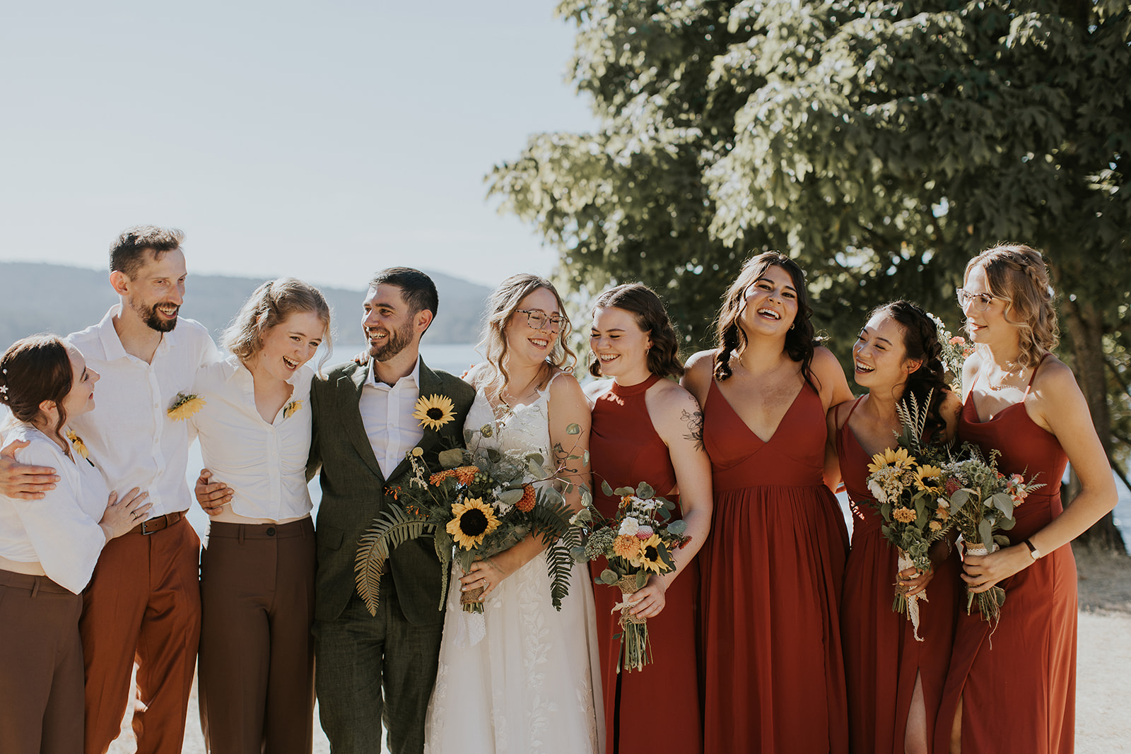wedding party smiling at each other on mayne island, bc