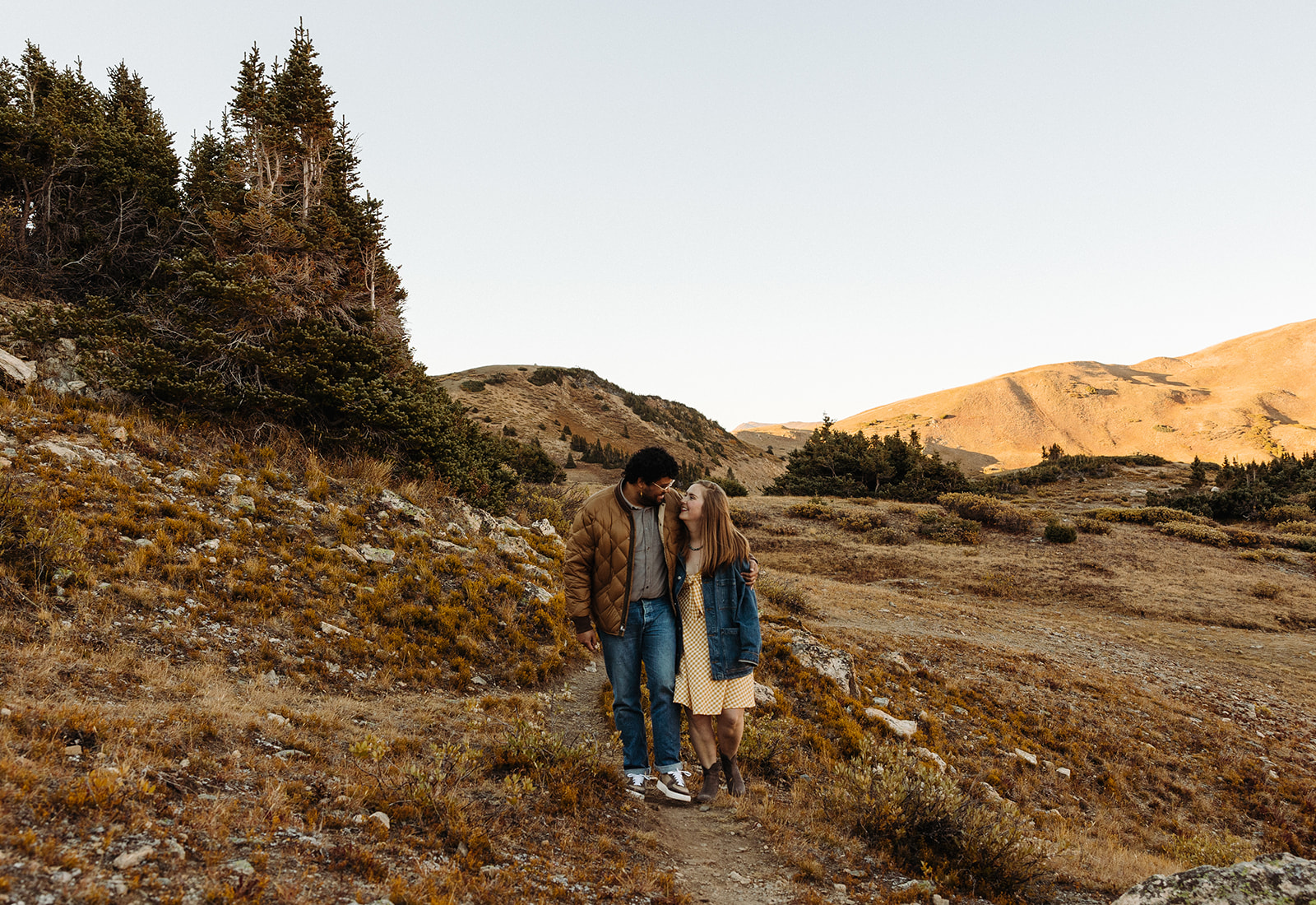 The mountains in the background have turned more golden and the couple walks, sharing a sweet moment.