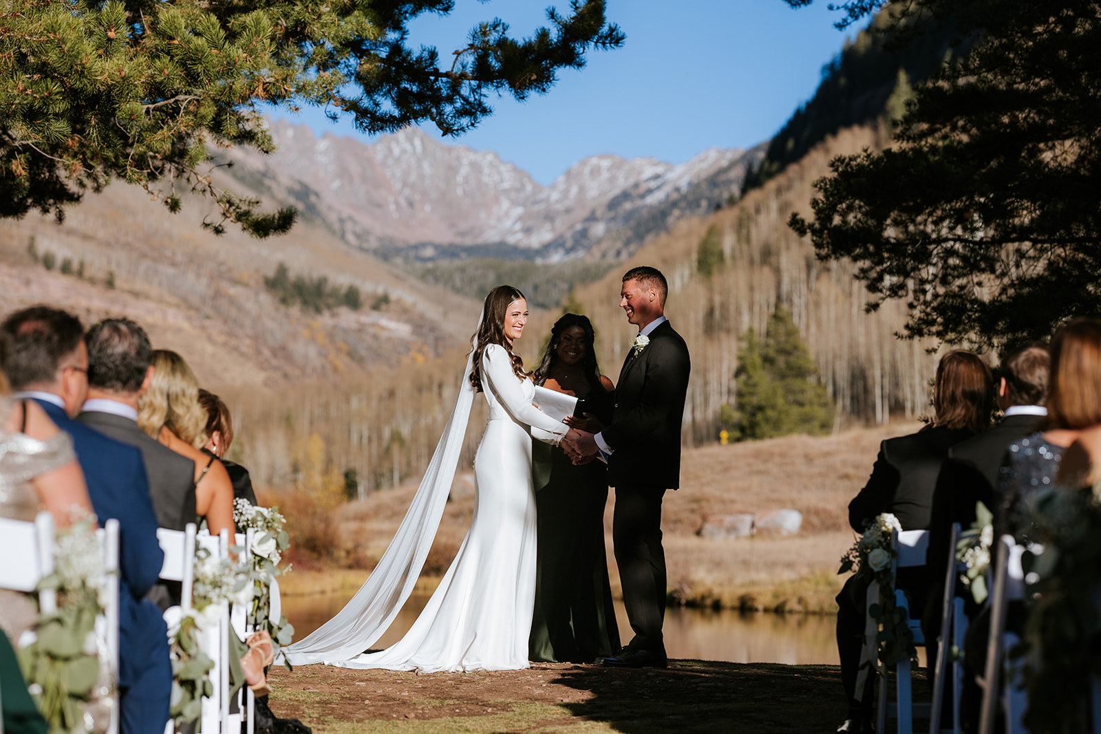 Colorado wedding ceremony on wedding island at Vail Golf Club and Nordic Center.